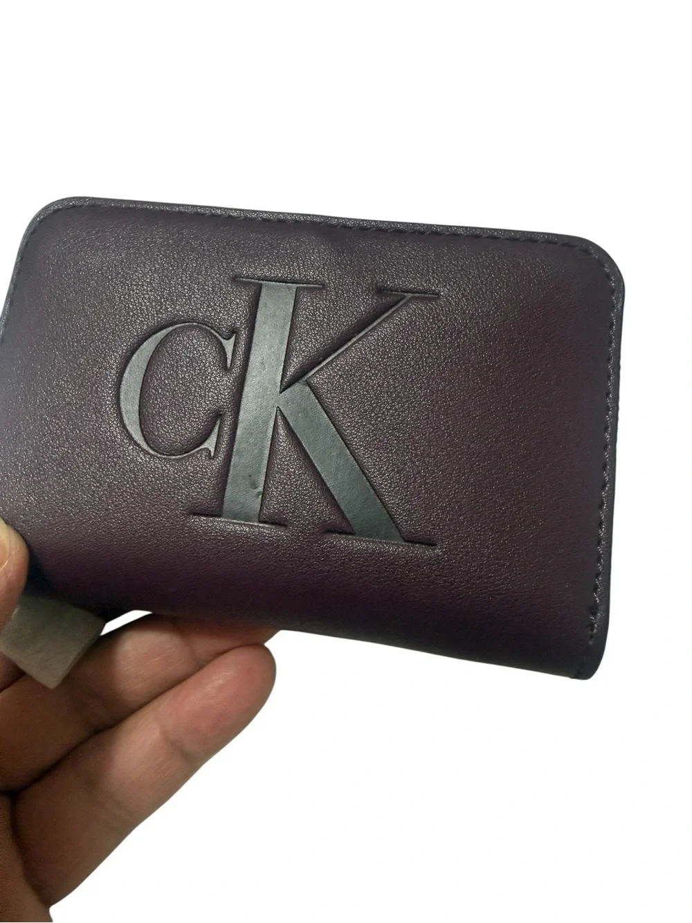 Calvin Klein Burgundy Zipper wallet with Embossed CK brand new